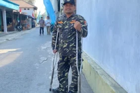 pakai-kruk,-anggota-banser-kota-malang-setia-mengabdi-di-tengah-keterbatasan-fisik